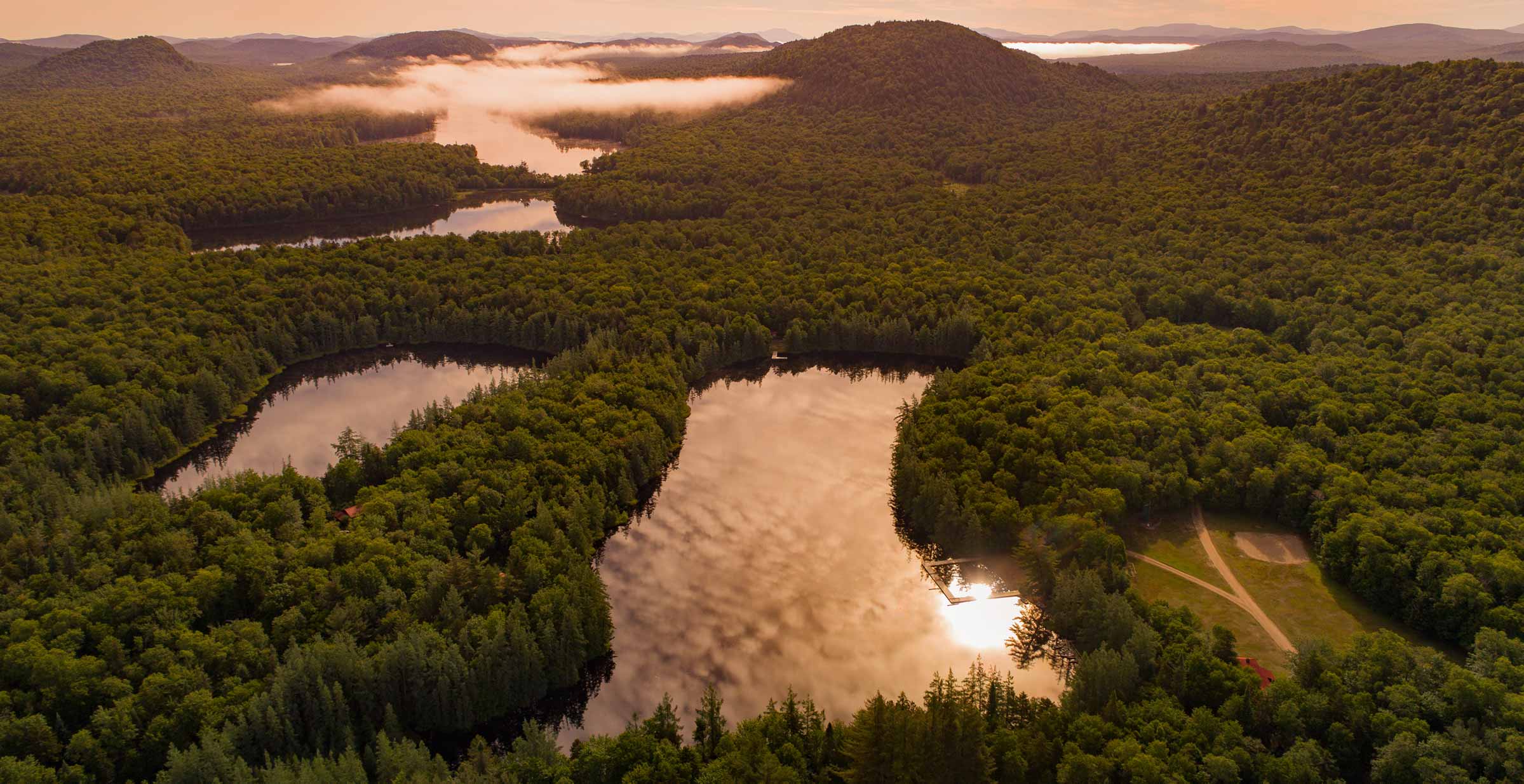 Aerial photo of various lakes located at Woodcraft Camps in the Adirondack Mountains of New York